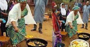 Mrs Aisha Buhari frying Bean Cakes