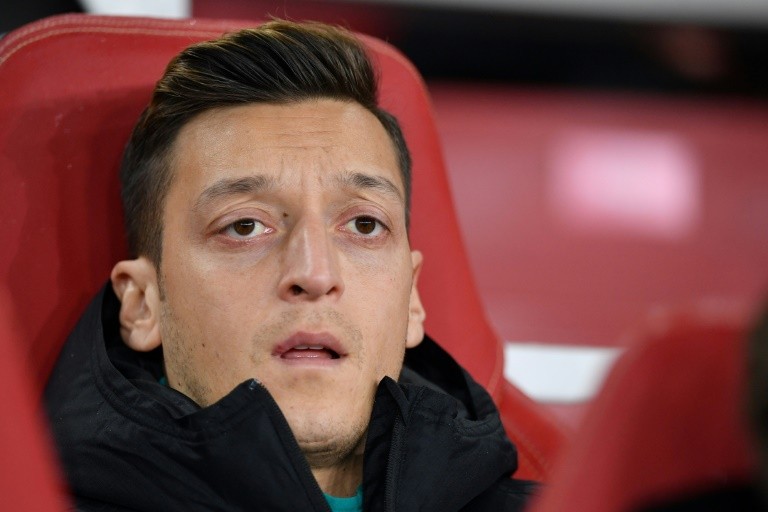 Two men threatened to "kill" Arsenal midfielder Mesut Ozil