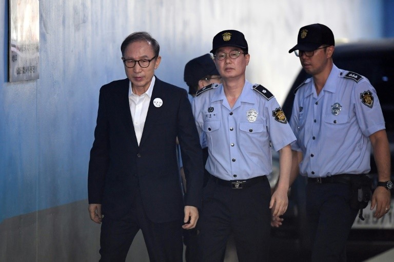 Former South Korean president Lee Myung-bak arriving at court to attend his original trial in 2018