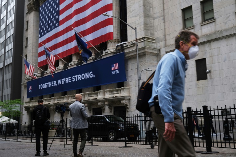 Floor trading resumes at NYSE, with masks and plexiglas