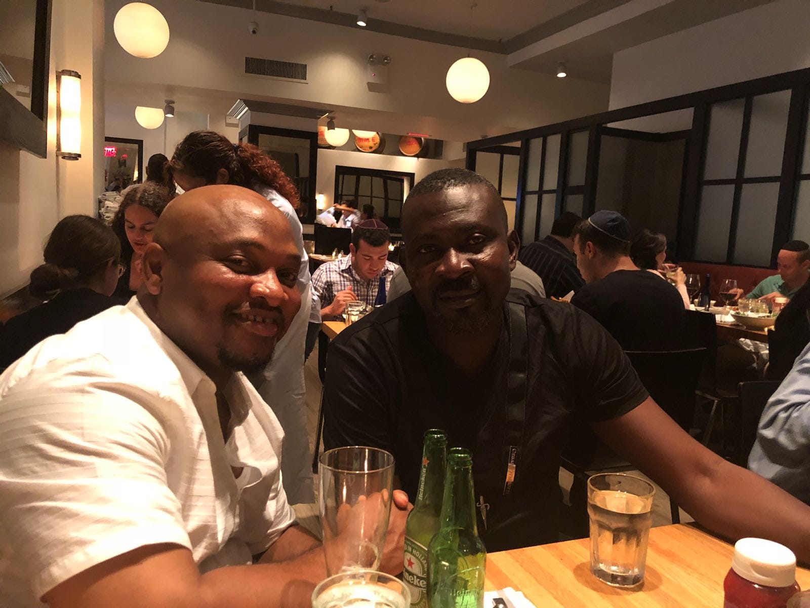 L-R: Prof. MarkAnthony Nze, Shamma Melody, and Melvin, in the background at the fine dinning Jewish restaurant, 2018 where the idea of People & Polity Inc., New York was conceived.